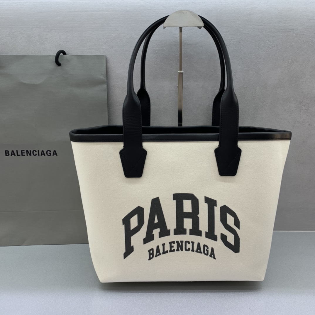 Balenciage Cities Paris Jumbo Large Tote Bag in beige and black cotton canvas and calfskin