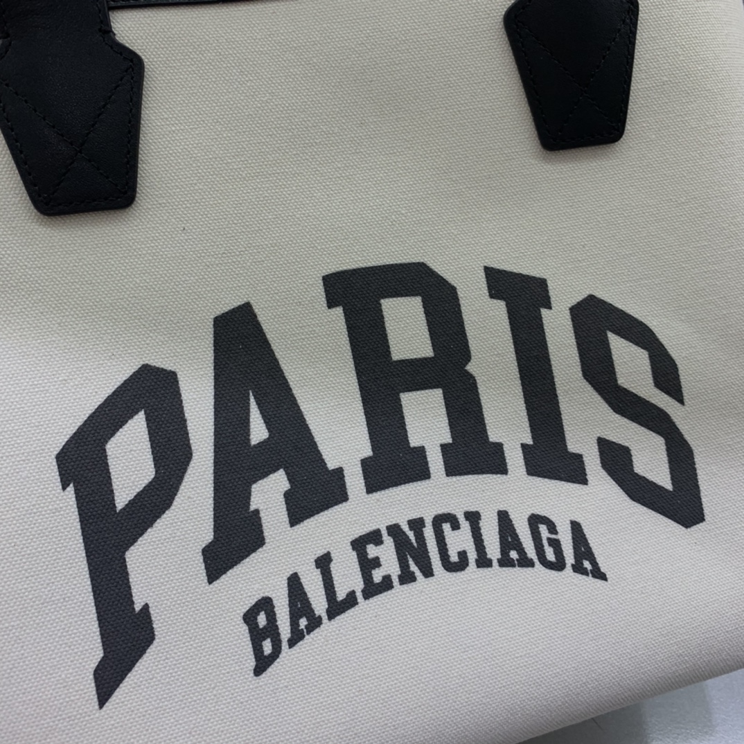 Balenciage Cities Paris Jumbo Large Tote Bag in beige and black cotton canvas and calfskin