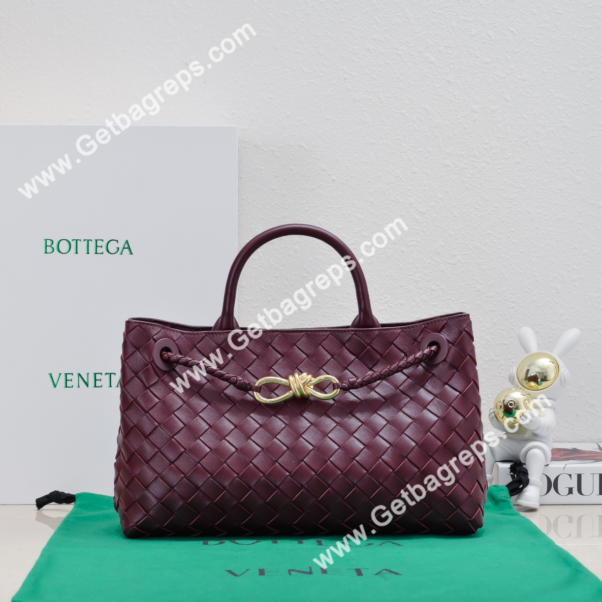Bottega Veneta 29cm East-West Andiamo Top Handle Bag in Supple Intrecciato Leather Wine