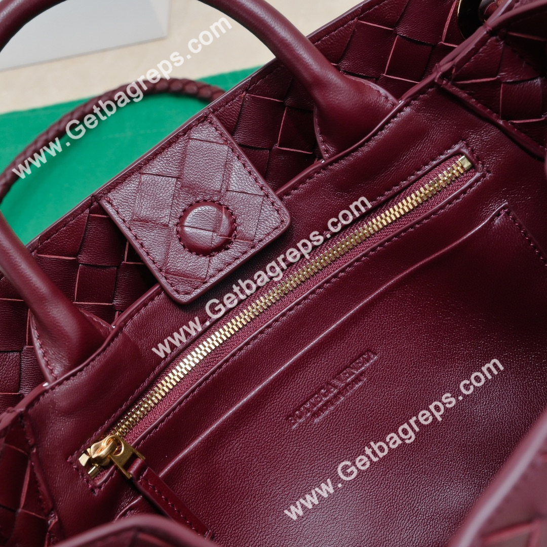 Bottega Veneta 29cm East-West Andiamo Top Handle Bag in Supple Intrecciato Leather Wine