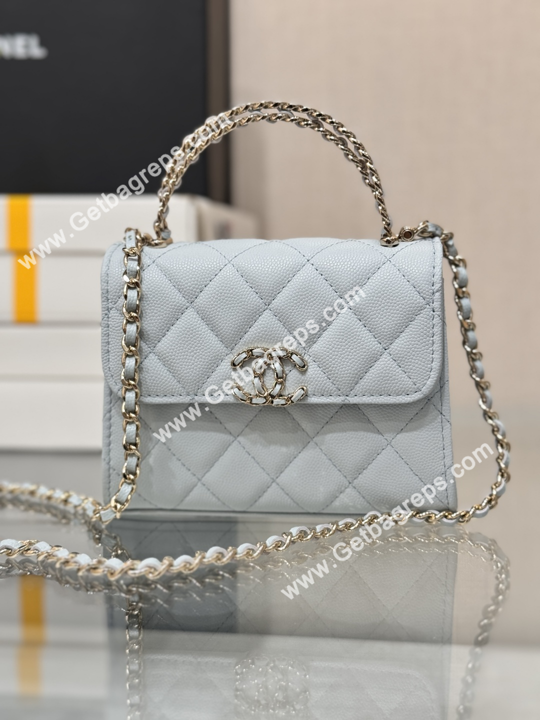 CHANEL Small Top Handle Phone Holder With Chain Light Blue Caviar Quilted 