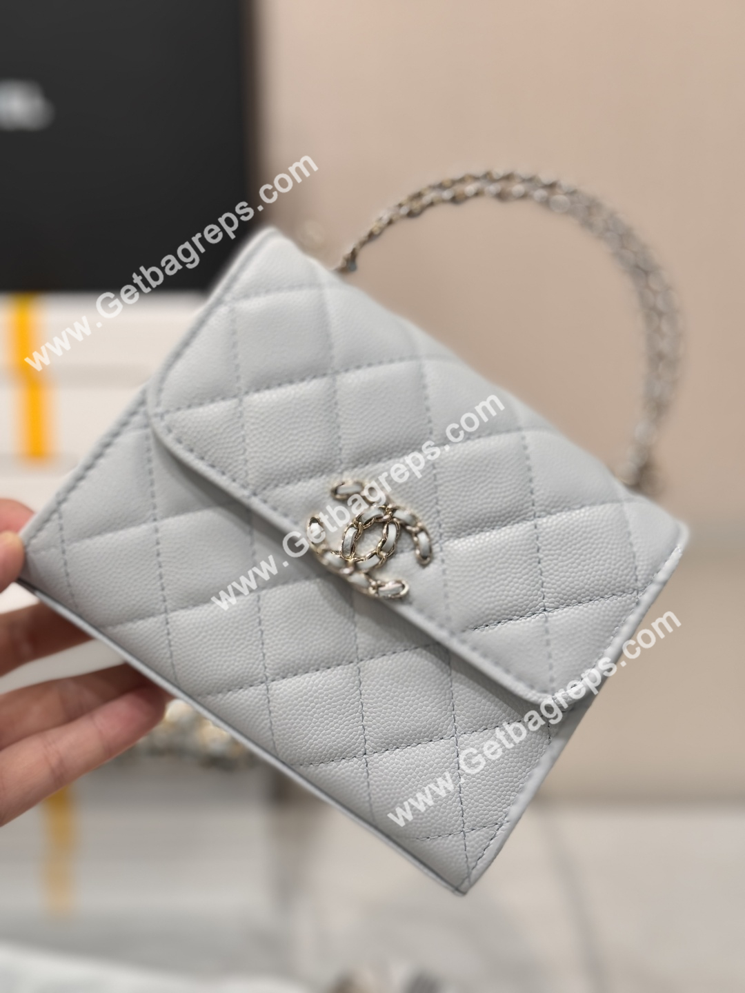 CHANEL Small Top Handle Phone Holder With Chain Light Blue Caviar Quilted 