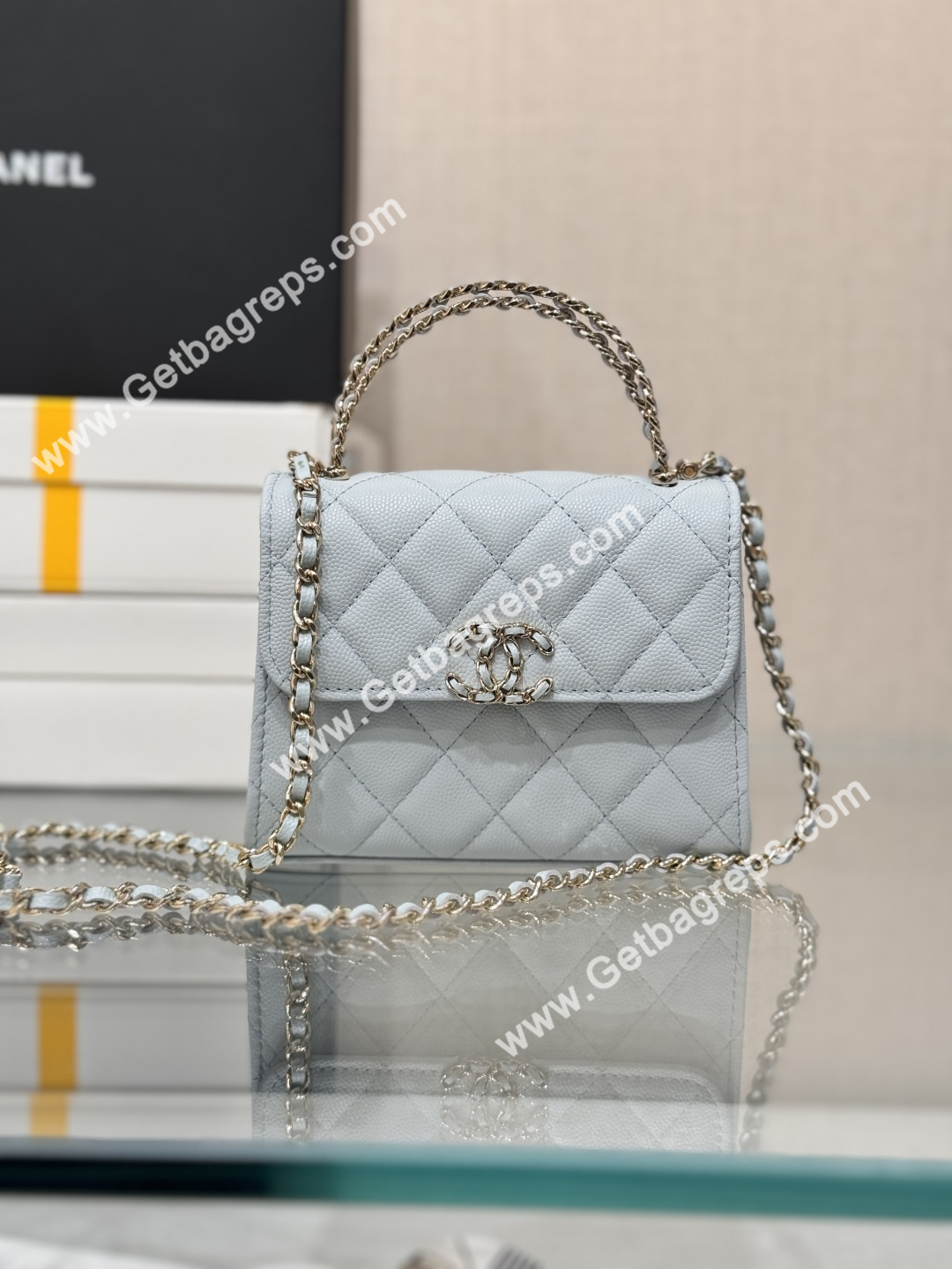 CHANEL Small Top Handle Phone Holder With Chain Light Blue Caviar Quilted 