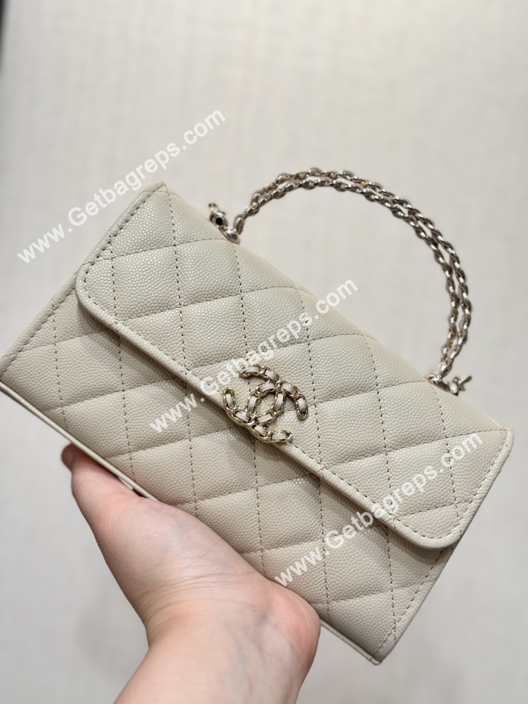 CHANEL Top Handle Phone Holder With Chain Beige Caviar Quilted