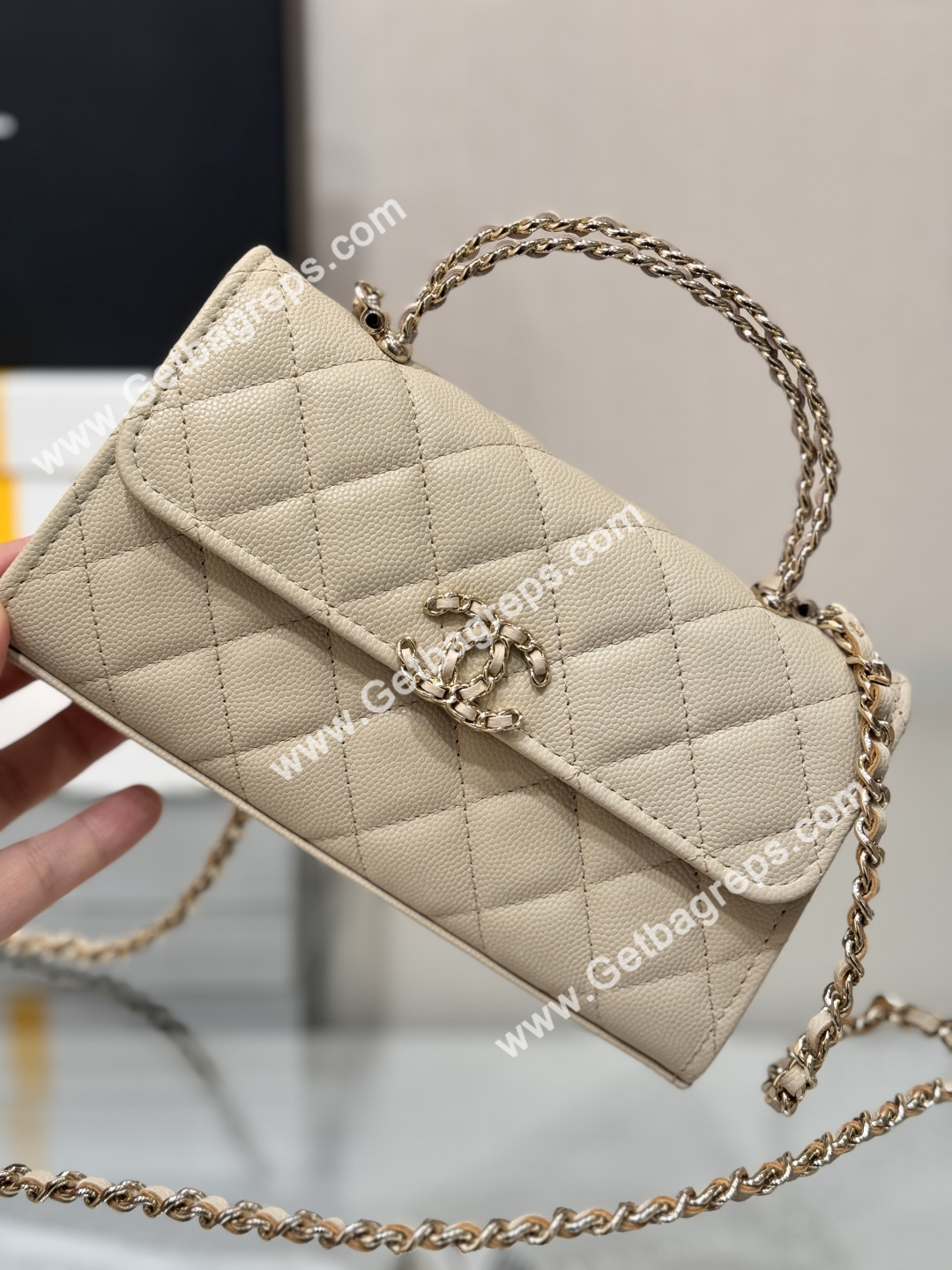 CHANEL Top Handle Phone Holder With Chain Beige Caviar Quilted