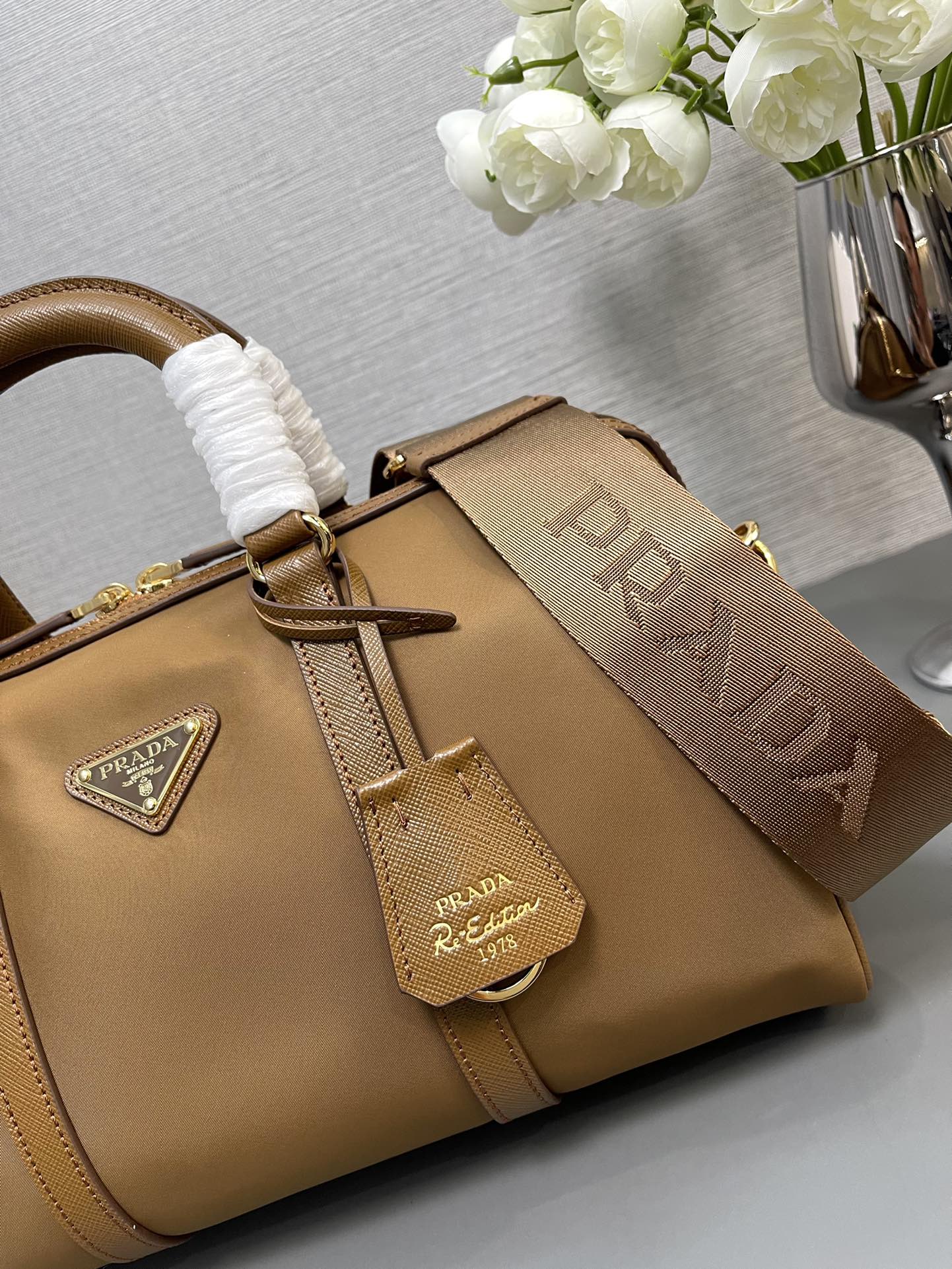 Prada 1BB233 Prada Re-Edition 1978 medium Re-Nylon and Saffiano leather top-handle bag Brown