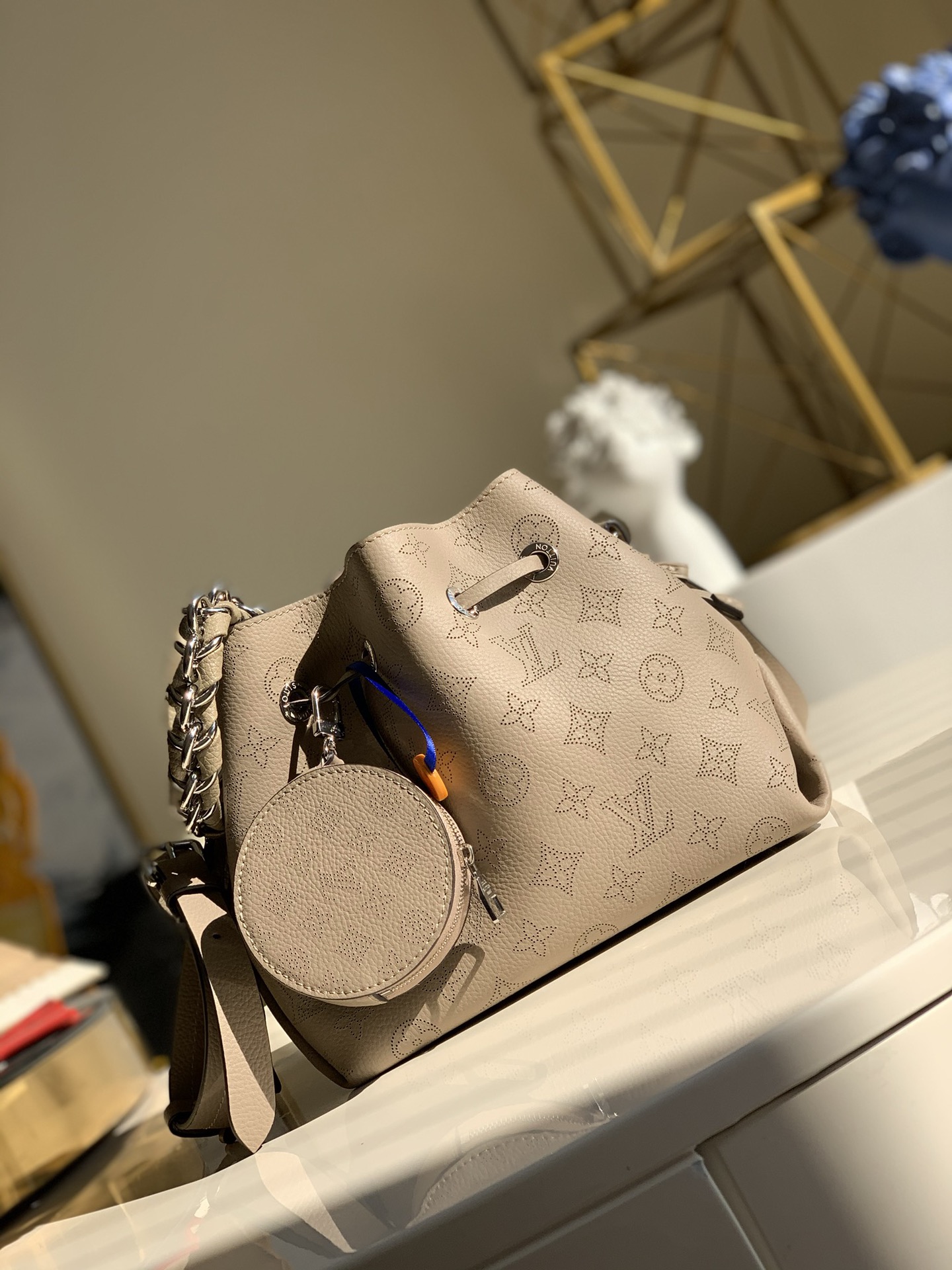 Replica Louis Vuitton M57201 Bella Bucket Bag in Mahina Calf Leather wite Perforated Monogram Pattern Galet