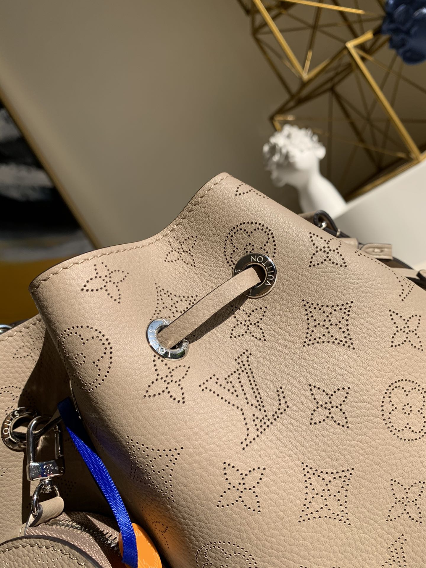 Replica Louis Vuitton M57201 Bella Bucket Bag in Mahina Calf Leather wite Perforated Monogram Pattern Galet